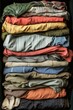 © Sunshine - Colorful Stack of Vintage Clothing in Various Fabrics and Patterns for Fashion and Textile Design Inspiration