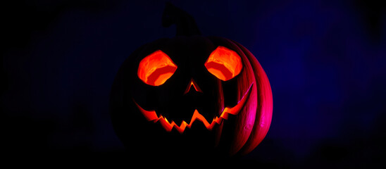 Canvas Print - glowing carved pumpkin with a menacing grin