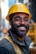 © Sunshine - Portrait of a Smiling Construction Worker in a Yellow Hard Hat on a Busy Urban Street