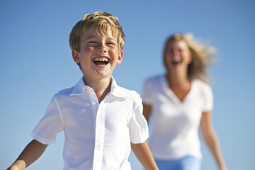 An adorable boy and his sister enjoy the beach together.