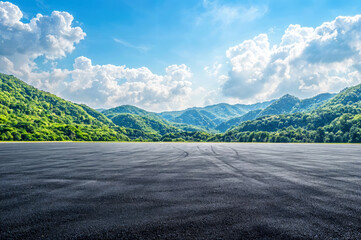 Canvas Print - Empty asphalt road surface with mountain landscape against sky