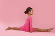 © New Africa - Portrait of little ballerina on pink background