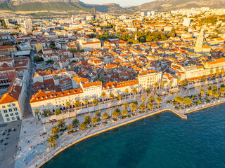 Croatia, aerial panoramic view from drone of Split city illuminated by the setting sun 