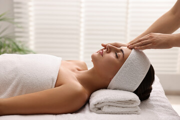 Poster - Attractive woman enjoying face massage in spa salon