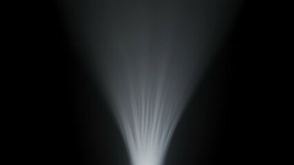 Wall Mural - a beam of light cuts through the foggy darkness.