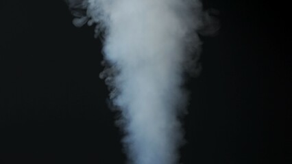 Wall Mural - close-up of white smoke clouds against a black background. contrast of brightly lit smoke and dark r