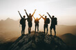 © ivlianna - Group of friends hiking to a mountain summit, arms raised in triumph as they reach the top together. .