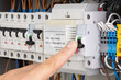 © MAXSHOT_PL - Finger Switching Off Circuit Breaker in Electrical Panel