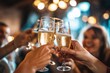 © Katsiaryna - A group of people clink champagne glasses. new year, christmas celebrating
