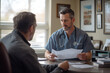 © boyhey - A doctor in scrubs sits at a desk in a hospital office. She is showing a patient her test results
