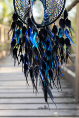 Wall Mural - Handmade dream catcher with feathers threads and beads rope hanging