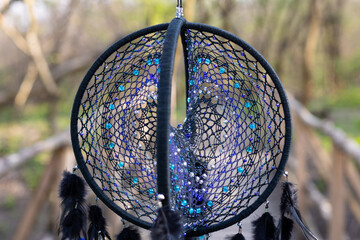 Wall Mural - Handmade dream catcher with feathers threads and beads rope hanging