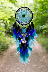 Wall Mural - Handmade dream catcher with feathers threads and beads rope hanging