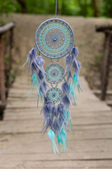 Wall Mural - Handmade dream catcher with feathers threads and beads rope hanging