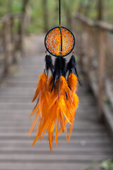 Wall Mural - Handmade dream catcher with feathers threads and beads rope hanging