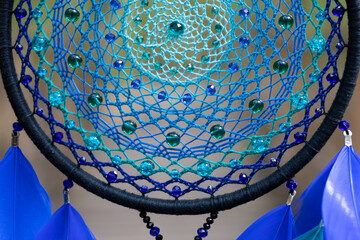 Wall Mural - Handmade dream catcher with feathers threads and beads rope hanging
