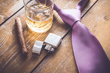 Cuban cigar and whiskey on an old wooden table