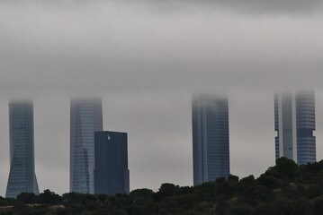 Cloudy sky hides the towers