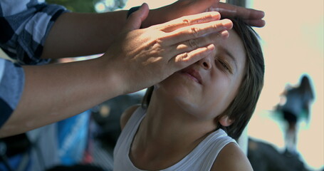 Applying sunscreen to a child's face in slow motion at 800 fps, emphasizing the gentle care and protection necessary for sensitive skin in sunny conditions