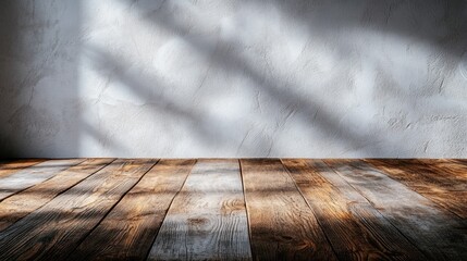 Poster - Soft sunlight streams through a window, illuminating a wooden floor while creating delicate shadows on a textured wall. The scene evokes calmness and warmth in a peaceful environment