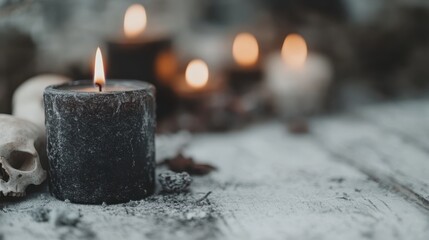 A black candle burns brightly on a weathered surface next to a skull, casting an eerie and mysterious glow, evoking thoughts of the supernatural and unknown.