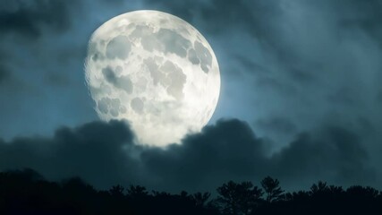 Aufkleber - Bright full moon is rising behind silhouettes of trees at night, with clouds passing in front of it and a blue and green tint to the sky