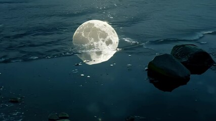 Poster - The full moon shines over the calm beach, reflecting on the dark ocean and rocks, creating a magical atmosphere of nature's beauty and celestial wonder