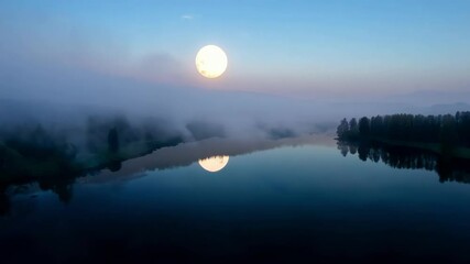 Poster - Full moon is rising over a misty lake, creating a beautiful reflection on the water's surface. The sky is a mix of blue and purple hues, adding to the serene atmosphere
