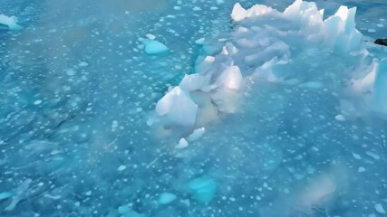 Aufkleber - Glistening ice floats peacefully on bright blue water, creating a mesmerizing natural pattern