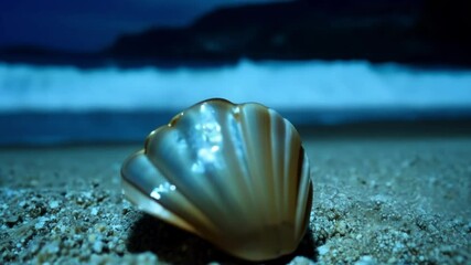 Aufkleber - Glowing seashell on a sandy beach at night, with ocean waves crashing in the background, illuminated by moonlight. Perfect for a tranquil escape