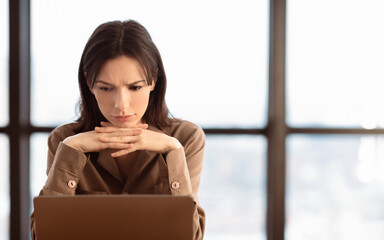 Aufkleber - Problems At Work. Confused girl working on laptop, thinking about solution, empty space