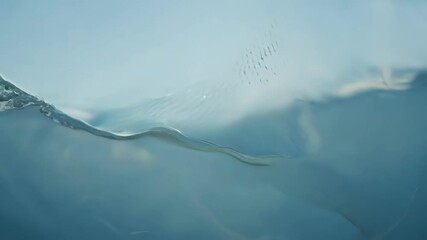 Aufkleber - Sunlight reflecting on the surface of a body of water creating abstract shapes with air bubbles visible below the surface
