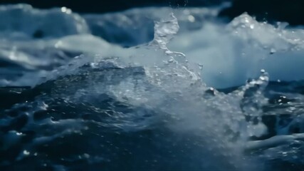 Poster - Powerful waves crashing against rocks in the ocean, creating mesmerizing water and foam textures. Blue sea flows and splashes, showcasing natural beauty. Feel energy and motion in stunning seascape