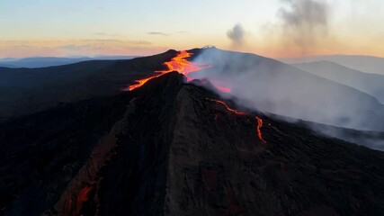 Poster - Molten lava flows from erupting volcano, smoke billows against twilight sky in aerial view. Red and orange glow contrasts with darkening evening sky, showcasing raw power of nature