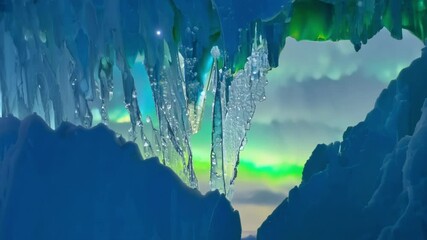 Poster - The aurora borealis lights up icicles on a snow covered cliff against a serene blue sky, creating a magical scene in the arctic wilderness. Explore this breathtaking display of nature's wonderland