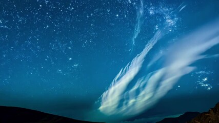 Aufkleber - Northern lights dancing across a deep blue night sky filled with countless stars shining brightly, creating a breathtaking and awe inspiring natural phenomenon