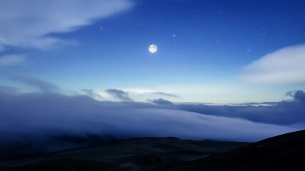 Poster - Breathtaking view of a night sky illuminated by the moon shining brightly, with clouds moving slowly over a vast landscape
