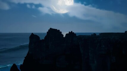 Aufkleber - Full moon is illuminating the ocean at night, creating a bright path of moonlight on the water behind the dark silhouettes of cliffs