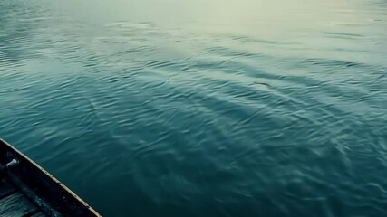 Aufkleber - Gentle waves are rippling on the surface of the water, creating a mesmerizing pattern in shades of blue and green, reflecting the serene beauty of the sky above