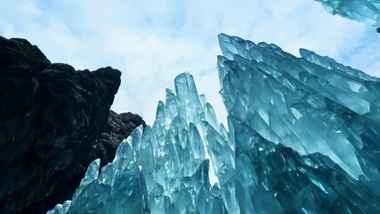 Aufkleber - The sun shines through a dark cave, revealing a giant aqua blue crystal formation sparkling and glistening, adding elegance and tranquility to the raw beauty of nature's geology