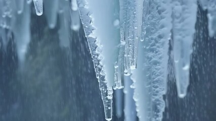 Aufkleber - Close up of melting icicles with water droplets, bringing the promise of warmer weather. The melting ice creates a beautiful and abstract pattern