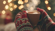 © Madeleine Steinbach - Hands in cozy warm mittens holding a mug with steaming hot chocolate at Christmas, with bokeh lights