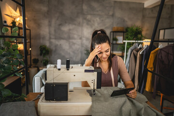 Exhausted adult woman watch video idea for new dress on mobile phone