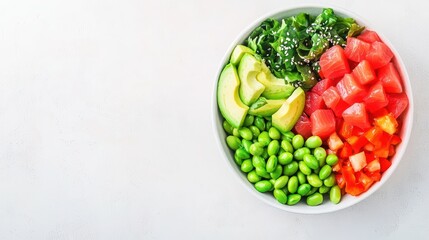 Colorful salad bowl with fresh vegetables, including greens, avocado, and watermelon on a light background.