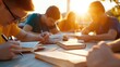 © LifeMedia - A diverse group of young students is deeply engaged in studying and writing at a sunlit outdoor table, suggesting collaboration and learning amidst nature.