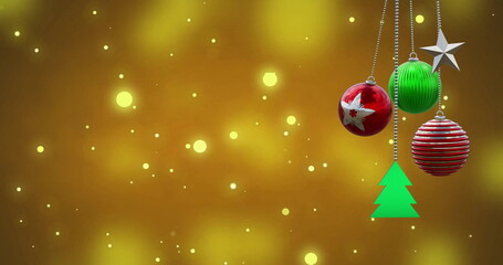 Wall Mural - Image of christmas baubles over light spots on orange background