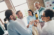 © deagreez - Photo of teamwork startup partners drink champagne celebration comfortable nice creative startup office loft room interior