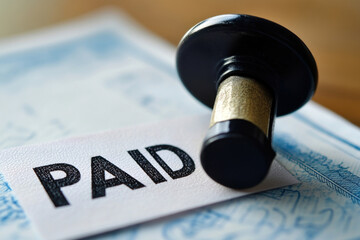 Close-up of a financial document stamped with a bold red 