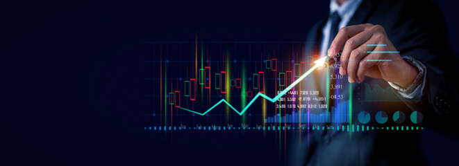 Close up of Businessman draws growth graph and progress of business and analyzing financial and investment data, business planning and strategy on blue background.