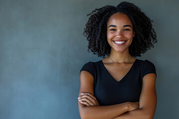 Woman with curly hair smiling at the camera.